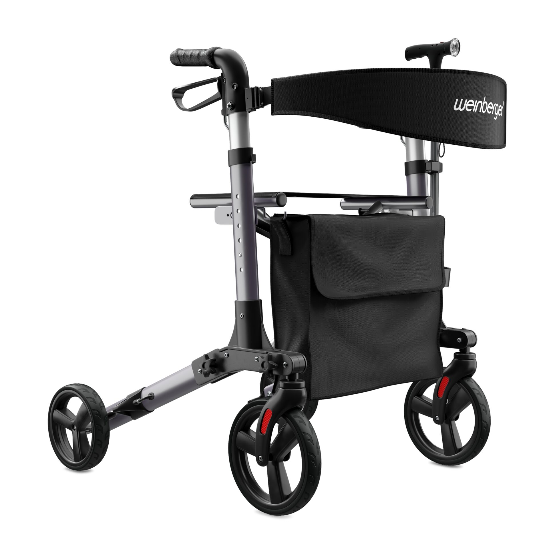 Ein Rollator mit schwarzen Rädern und einer leicht zugänglichen schwarzen Tasche für den Einkauf oder persönlichen Gegenstände.